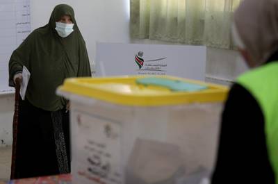 A woman arrives to cast her vote during parliamentary elections in Amman. Reuters