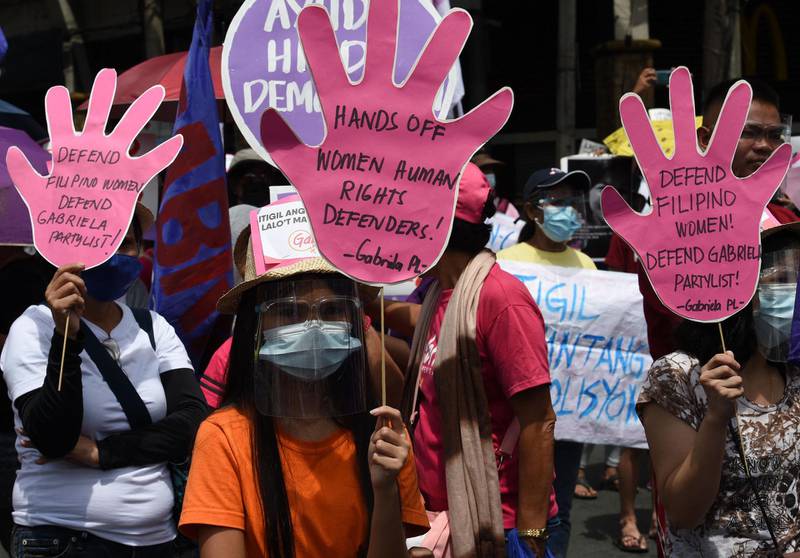 Women's group Gabriela protests on International Women's Day near the presidential palace in Manila, the Philippines. AFP