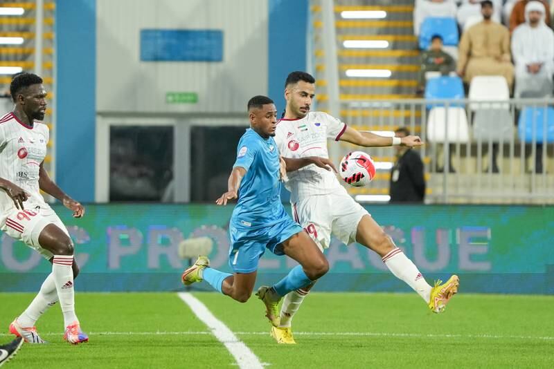 Khaled Al Dhahnani, right, who scored the opening goal in Sharjah’s 2-0 win, is challenged by Dibba's Jaja Silva in the Adnoc Pro League at Dibba Stadium on Sunday, December 25, 2022. Photo: PLC