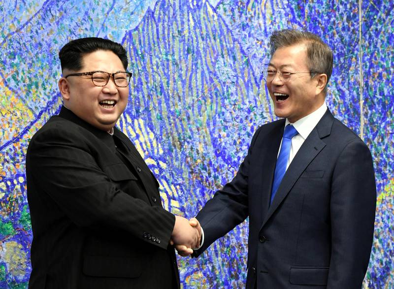South Korean President Moon Jae-in shakes hands with North Korean leader Kim Jong Un during their meeting at the Peace House at the truce village of Panmunjom inside the demilitarized zone separating the two Koreas, South Korea, April 27, 2018.   Korea Summit Press Pool/Pool via Reuters