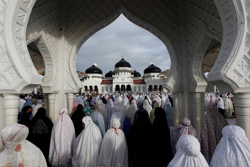 Indonesian women pray during Eid Al Fitr, the festival marking the end of Ramadan, at a mosque in Banda Aceh, Aceh Province, Indonesia. Reuters