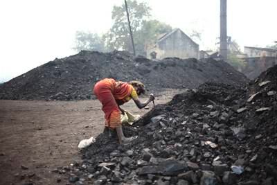 Jharia - Dec. , 2009 - A local woman steals coal from the Government Coal   storage depot at Jharia. (Subhash Sharma for The National)