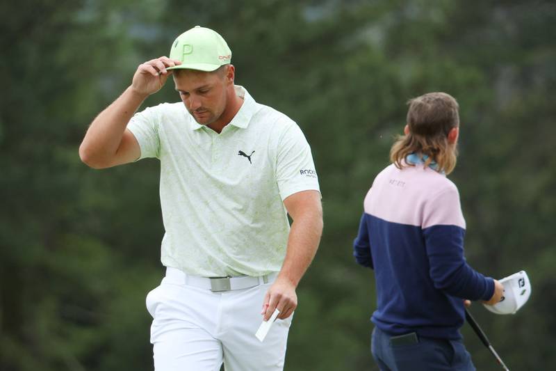 Bryson DeChambeau reacts on the 18th green after finishing his second round at The Masters at Augusta National Golf Club on April 8, 2022. The world No 22 missed the cut after shooting a 76 and an 80. Getty / AFP
