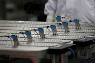 Vaccine doses are prepared at the Sinopharm production centre in Beijing. Reuters
