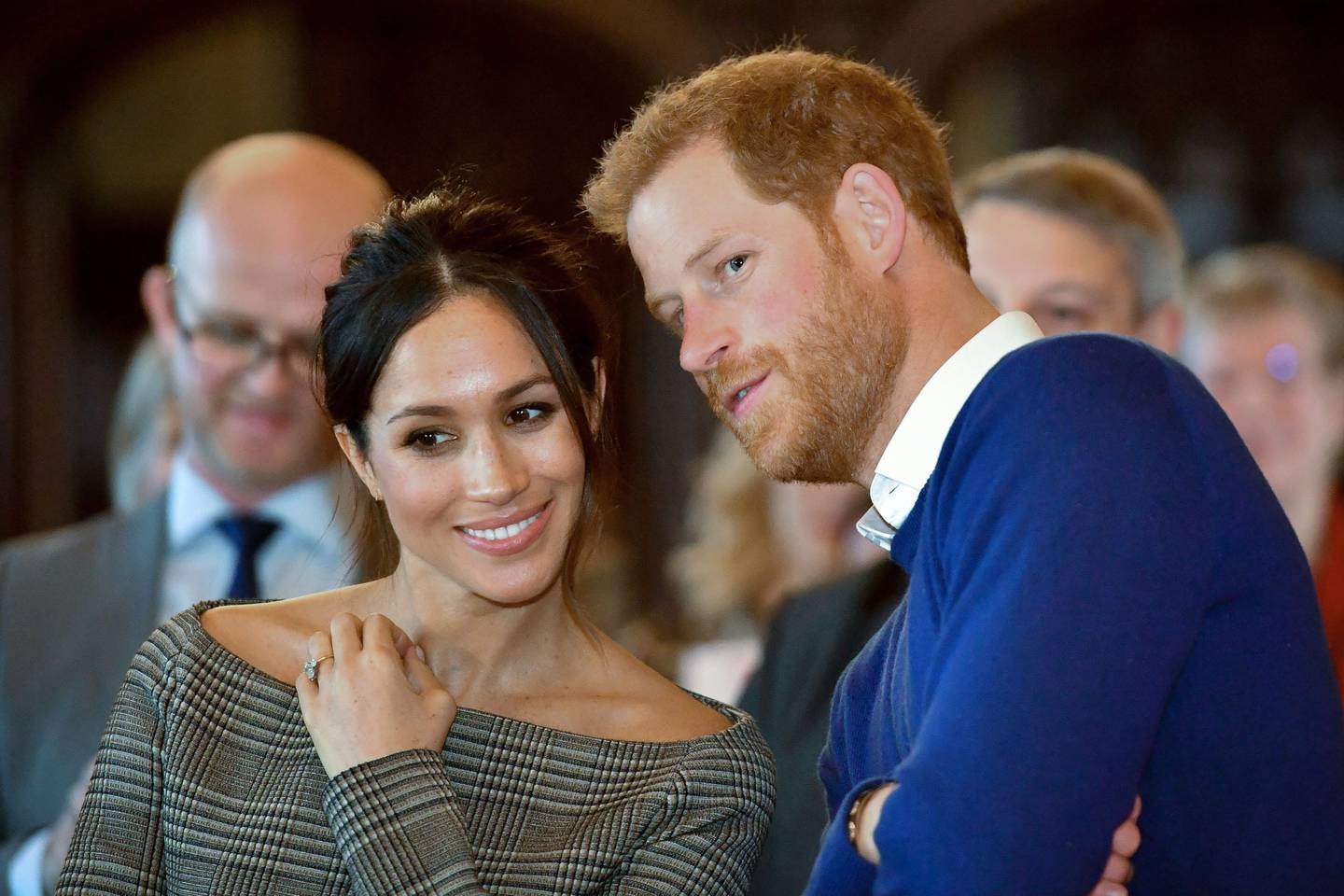 (FILES) In this file photo taken on January 18, 2018 Britain's Prince Harry and his fiancée US actress Meghan Markle watch a dance performance by Jukebox Collective during a visit at Cardiff Castle in Cardiff, south Wales on January 18, 2018, for a day showcasing the rich culture and heritage of Wales. Meghan Markle once struggled for roles but the US actress has now landed the biggest part of all as she prepares to marry Prince Harry on May 19, 2018 and become the newest face in Britain's royal family. / AFP / POOL / Ben Birchall

