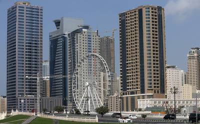 Buildings near Al Qasba area in Sharjah. There were real estate sales in 96 areas of the emirate in July. Pawan Singh / The National
