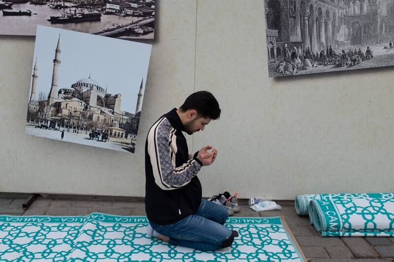 A worshipper prays outside the Hagia Sophia Grand Mosque. Getty 