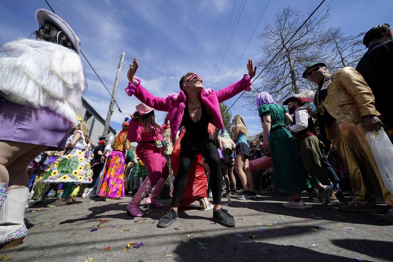 A person dances at the Societe de Sainte Anne parade during Mardi Gras on March 1, 2022, in New Orleans. AP