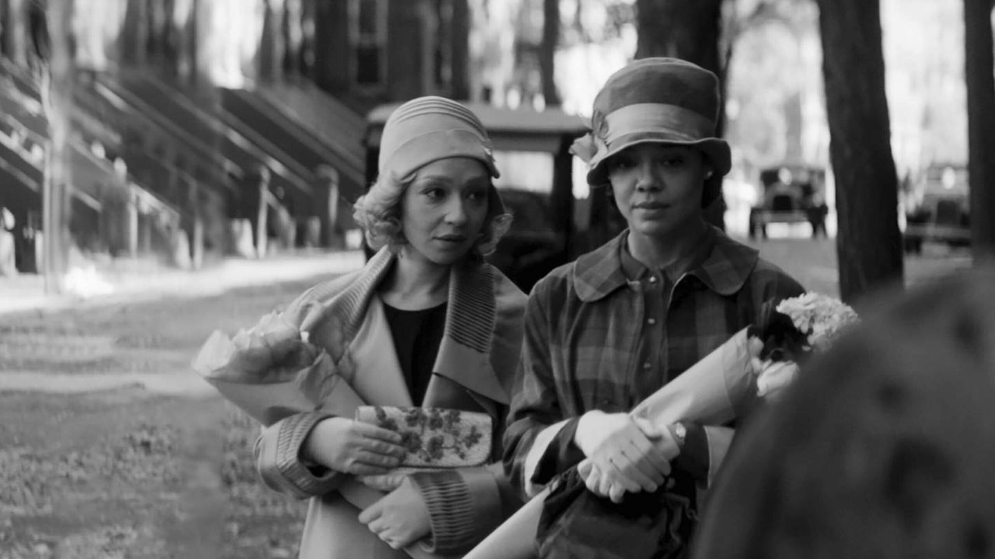 This image released by the Sundance Institute shows Ruth Negga, left, and Tessa Thompson in a scene from "Passing." The film, a directorial debut by Rebecca Hall, will debut at the 2021 Sundance Film Festival. (Sundance Film Festival via AP)