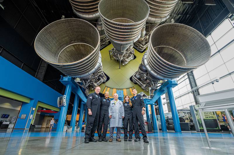 The Inspiration4 crew, left to right, Chris Sembroski, Sian Proctor, Hayley Arceneaux and Jared Isaacman pose with a technician, centre, in Huntsville, Alabama. AFP