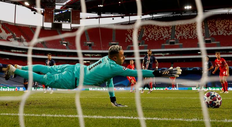 PSG goalkeeper Keylor Navas stretches to try and make a save. AP