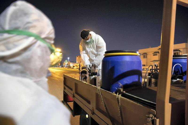 SHARJAH, UNITED ARAB EMIRATES. 26 MARCH 2020. Sharjah Municipal staff prepare to spray and disinfect the sidewalk along the Al Muntazah Str area of Sharjah near the Ajman border. (Photo: Antonie Robertson/The National) Journalist: None. Section: National.