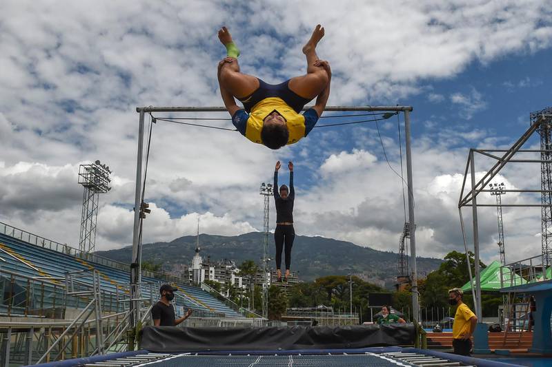 Colombian national diving team members Daniel Restrepo and Diana Pineda train for the first time since the coronavirus lockdown began, in Medellin, Colombia on September 9, 2020. AFP