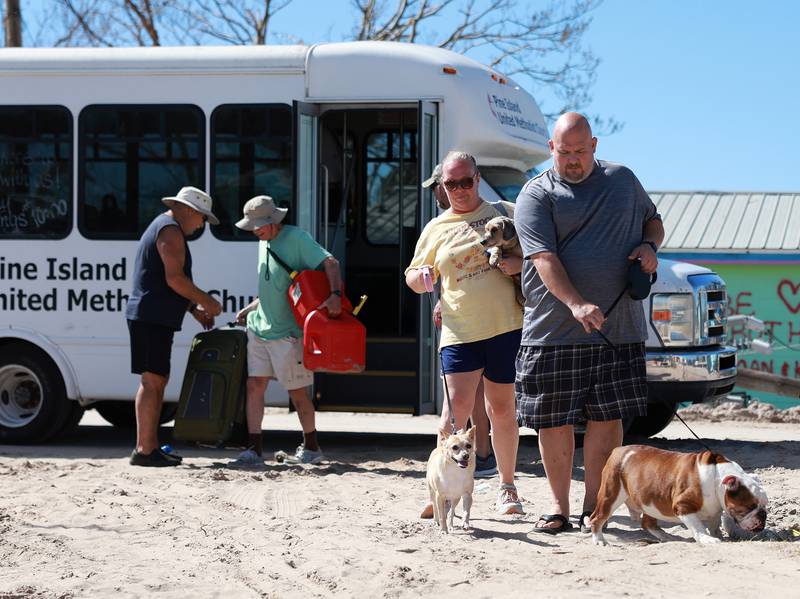 Pine Island residents and their dogs. Getty / AFP