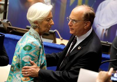 Managing Director and Chairwoman of the International Monetary Fund Christine Lagarde, left, speaks with Larry Fink, the chairman and CEO of BlackRock, an American multinational investment management corporation before the High-level Meeting on Financing the 2030 Agenda for Sustainable Development at United Nations headquarters.  EPA