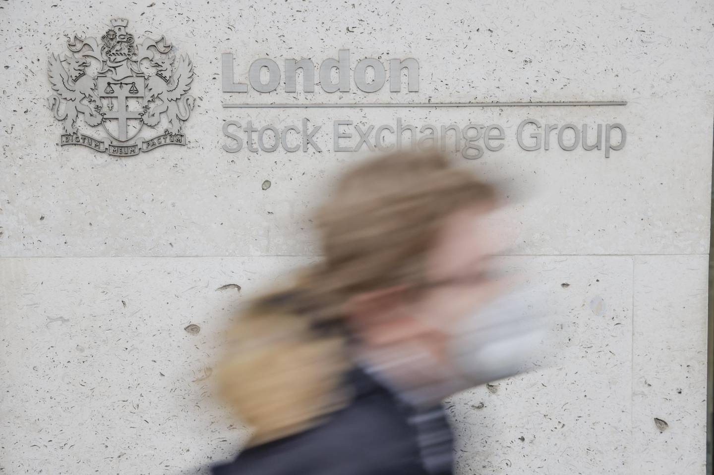 A pedestrian passes the London Stock Exchange in the square mile financial district of the City of London, U.K., on Monday, Jan. 4, 2021. Britain's long-awaited trade deal with the European Union still leaves many questions unanswered for the world's biggest banks, trading venues and money managers as they prepare for a rupture in the region's financial system. Photographer: Jason Alden/Bloomberg