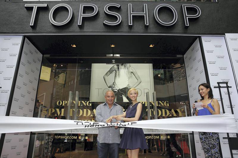 HONG KONG - JUNE 06: Sir Philip Green the owner of Topshop and Taiwanese actress Gwei Lun Mei cut a ribbon to mark the opening of the new Topshop store as TV host Mandy Lieu watches on June 6, 2013 in Hong Kong, Hong Kong. Gwei Lun Mei is the the first Asian ambassador of Topshop. (Photo by Jessica Hromas/Getty Images)
