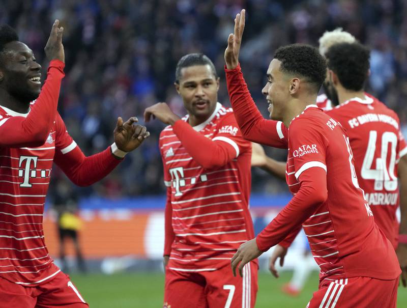 Bayern Munich's Jamal Musiala, right, celebrates after scoring the opening goal in the 3-2 Bundesliga win at Hertha Berlin on November 5, 2022. AP