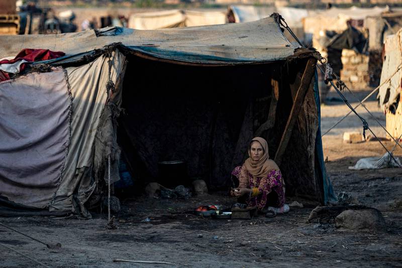 A woman at the Yunani camp. Many inhabitants are from rural areas of Raqqa and Hama provinces and were displaced by fighting in Syria's civil war.