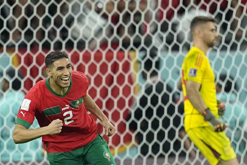 Morocco's Achraf Hakimi turns away after scoring the winning penalty in the shoot-out against Spain at Education City Stadium. AP