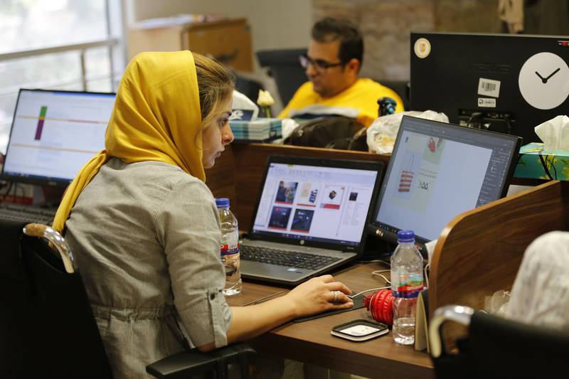 (FILES) This file photo taken on July 09, 2017 shows Bamilo employees working at the e-commerce site's offices in the Iranian capital Tehran.
Iranians have been joined by a minister in protest after Apple removed popular apps from its store, which the American company says has been done to comply with US sanctions. / AFP PHOTO / ATTA KENARE