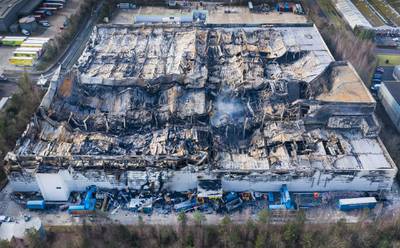 Mandatory Credit: Photo by Peter MacDiarmid/REX/Shutterstock (10107227b)As the ruins still smoulder aerial photographs show the fire damage and the remains of the Ocado warehouse in Andover after the fire was mostly extinguished. The fire raged for three days starting a week ago with 300 fire fighters tackling the blaze at the giant robotic warehouse.Ocado warehouse damage revealed, Andover, UK - 14 Sep 2017