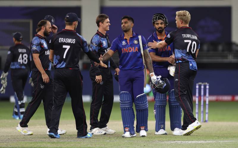 India batsmen Suryakumar Yadav and KL Rahul, second right, greet Namibia players after the match in Dubai. AP