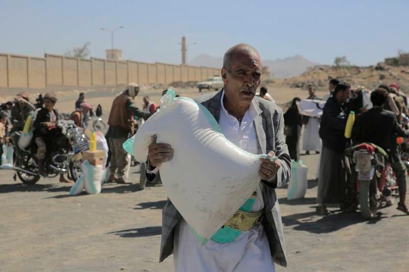 A Yemeni man receives food aid in Sanaa, Yemen, on February 26. EPA