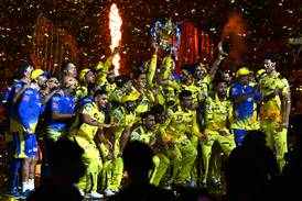 Chennai Super Kings' players celebrate with the trophy after their victory against Gujarat Titans in the IPL Twenty20 final at Narendra Modi Stadium in Ahmedabad on May 30. AFP