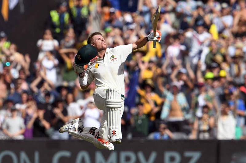Australian batsman David Warner celebrates his century against Pakistan on December 28, 2016, the third day of the second cricket Test match in Melbourne, Australia. William West / Agence France-Presse