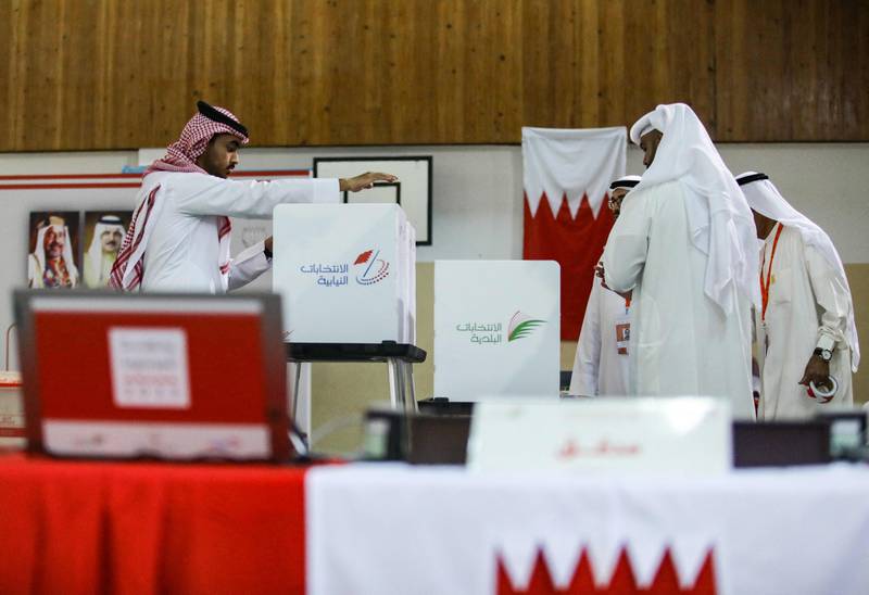 Clerks prepare ballot boxes at a polling station on the island of Muharraq, north of Manama.