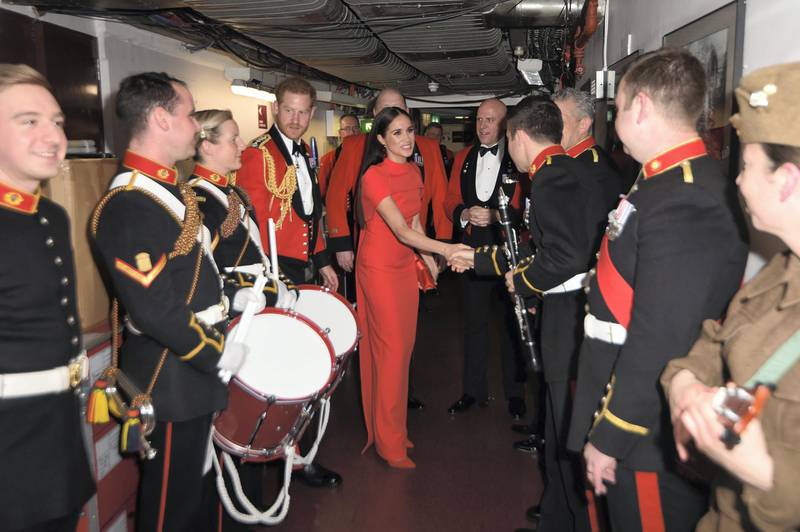LONDON, ENGLAND - MARCH 07: Prince Harry, Duke of Sussex and Meghan, Duchess of Sussex meet band members as they attend the Mountbatten Music Festival at the Royal Albert Hall on March 7, 2020 in London, England. (Photo by Eddie Mulholland-WPA Pool/Getty Images)