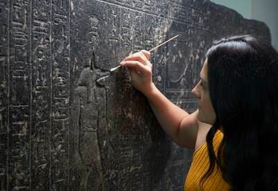 Senior conservator Stephanie Vasiliou cleans ‘The Enchanted Basin’ in preparation for the exhibition. Photo: The Trustees of the British Museum