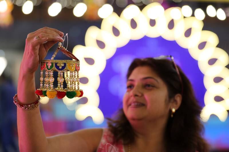Ruma shops for gifts at BurJuman Mall in Dubai ahead of Diwali. With Covid-19 curbs lifted in most places, five-day celebrations of the festival of lights are set to return in full force around the world. Chris Whiteoak / The National
