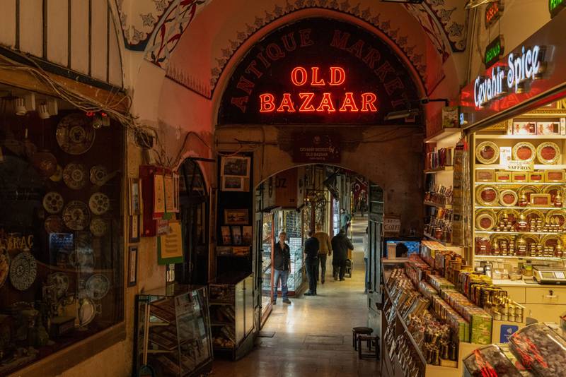 A shopkeeper waits for customers in an alleyway of the Grand Bazaar in Istanbul