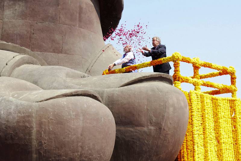 India's Prime Minister Narendra Modi and United Nations Secretary General Antonio Guterres scattering rose petals at the Statue of Unity in Kevadia, Gujarat state. AFP
