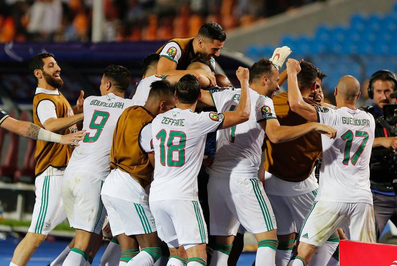 Algerian players celebrate after beating Nigeria 2-1 in their Africa Cup of Nations semi-final in Cairo. AP Photo