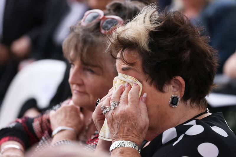 A family member sheds tears during the national memorial service. Getty Images