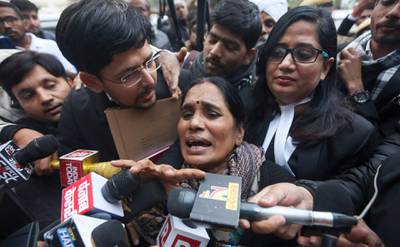 Asha Devi, mother of the victim of the fatal 2012 gang rape on a moving bus, speaks to the media as she leaves a court in New Delhi, India, Tuesday, Jan. 7, 2020. A death warrant was issued Tuesday for the four men convicted in the 2012 gang rape and murder of a young woman on a New Delhi bus that galvanized protests across India and brought global attention to the country's sexual violence epidemic. A New Delhi court scheduled the hangings for Jan. 22, the Press Trust of India news agency reported. (AP Photo)