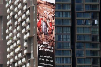 A promotional banner for the upcoming HSBC Women's World Championship, which was cancelled due to concerns about the novel coronavirus, is displayed in the financial district in Singapore on February 10, 2020. Golf's HSBC Women's World Championship in Singapore later this month was cancelled on February 10 as was next week's LPGA Thailand tournament, meaning the US women's Tour has now lost all three of their lucrative early-season events in Asia. / AFP / Roslan RAHMAN
