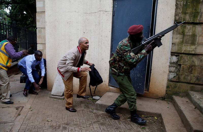 A member of the security forces keeps guard as people are evacuated. Thomas Mukoya / Reuters
