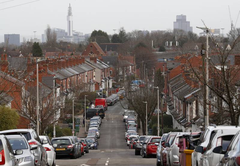 Cars parked on a street of terraced homes in Birmingham, UK. UK government officials have suggested paying people to stay home if they test positive for coronavirus, amid concerns too many are failing to get tested or comply with the lockdown rules. Bloomberg