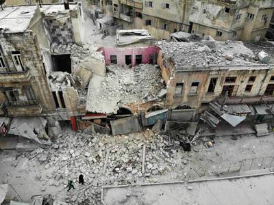An aerial view shows a destroyed building following a regime air strike on Ariha. AFP