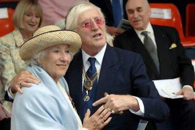 Vera Lynn and Jimmy Saville, right, attend the September 2005 unveiling of a sculpture at Victoria Embankment in central London to mark the 65th anniversary of the Battle of Britain.