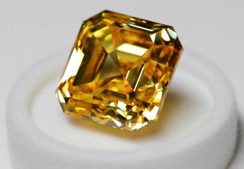 A 20.69-carat yellow diamond is pictured during an official presentation by diamond producer Alrosa in Moscow in 2019. Reuters