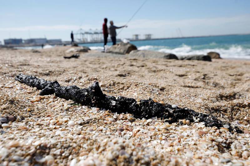 A clump of tar is seen on the sand after an offshore oil spill drenched much of Israel's Mediterranean shoreline with tar, at a beach in Ashdod, southern Israel. Reuters