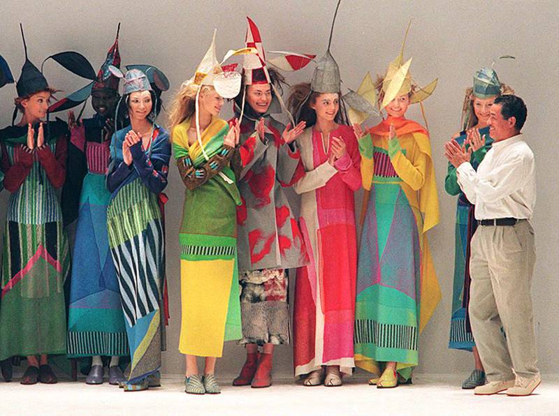 Miyake returns his models' applause in Paris at the end of his autumn/winter 1997-1998 ready-to-wear show. AFP