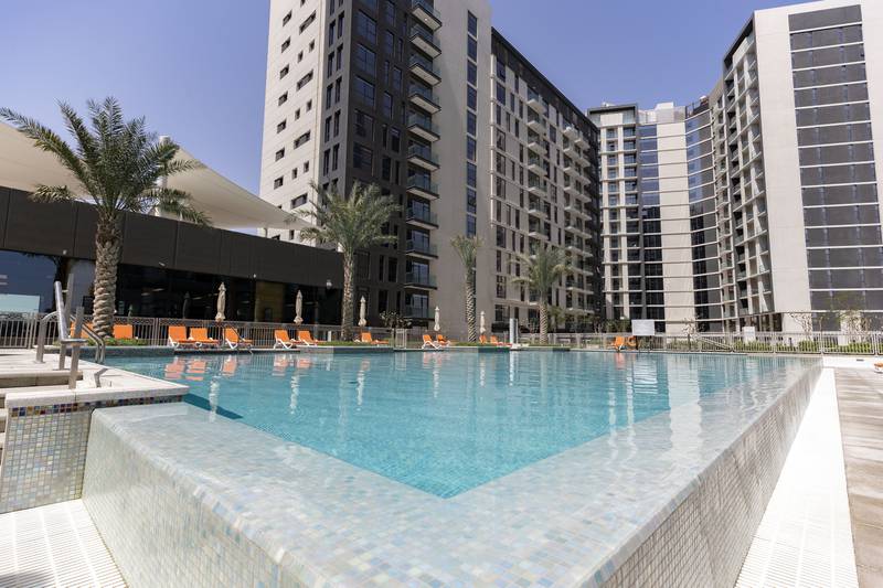 Communal swimming pool at Expo Village in Dubai. Photo by Chris Whiteoak / The National