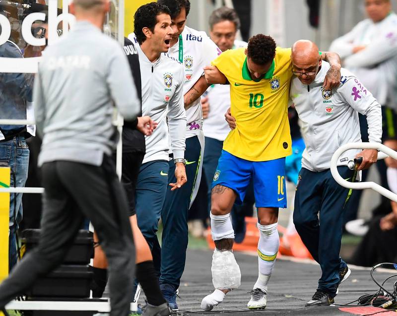 Brazil's Neymar leaves the pitch injured during a friendly football match against Qatar at the Mane Garrincha stadium in Brasilia on June 5, 2019. The Brazil captain was later ruled out of the tournament. AFP
