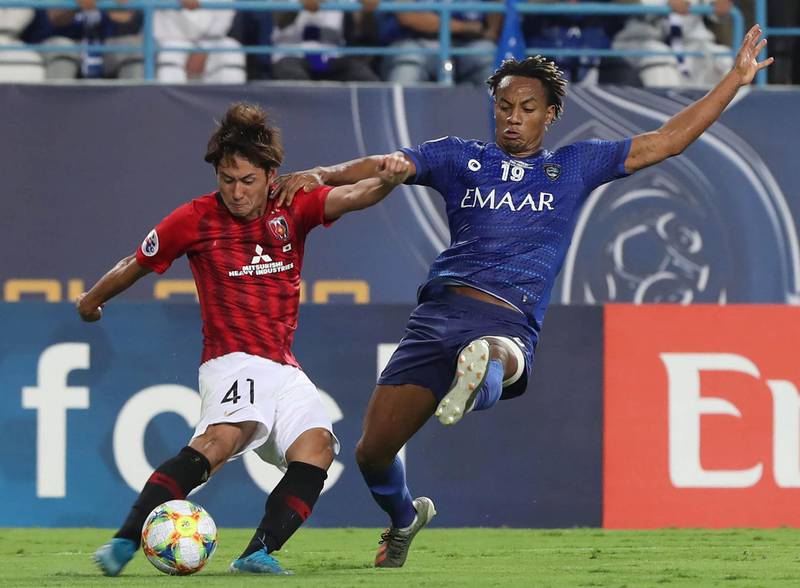Al Hilal player Andre Carrillo, right, in action against Urawa Red Diamonds' Takahiro Sekene during the AFC Champions League final first-leg match at King Saud University Stadium in Riyadh. EPA